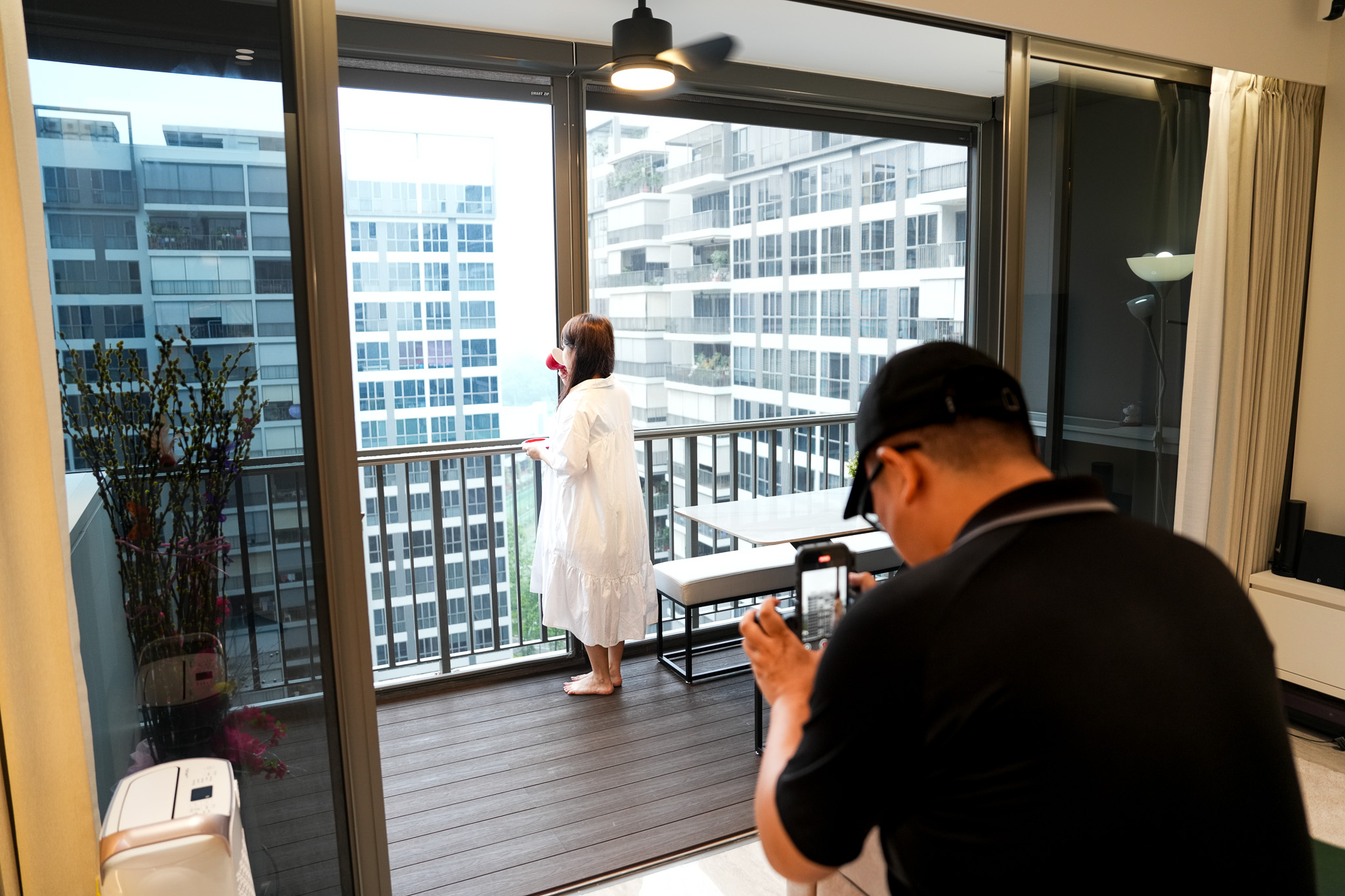 Lumida Studios photographing a lifestyle moment on a condominium balcony