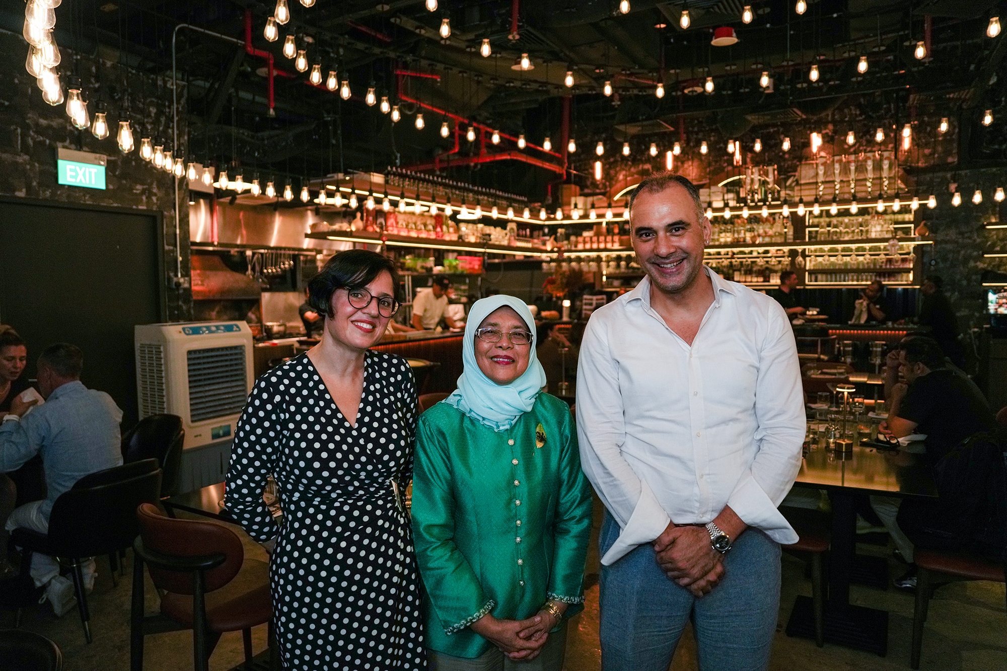 Singapore's former president with two guests inside Pera's dining room
