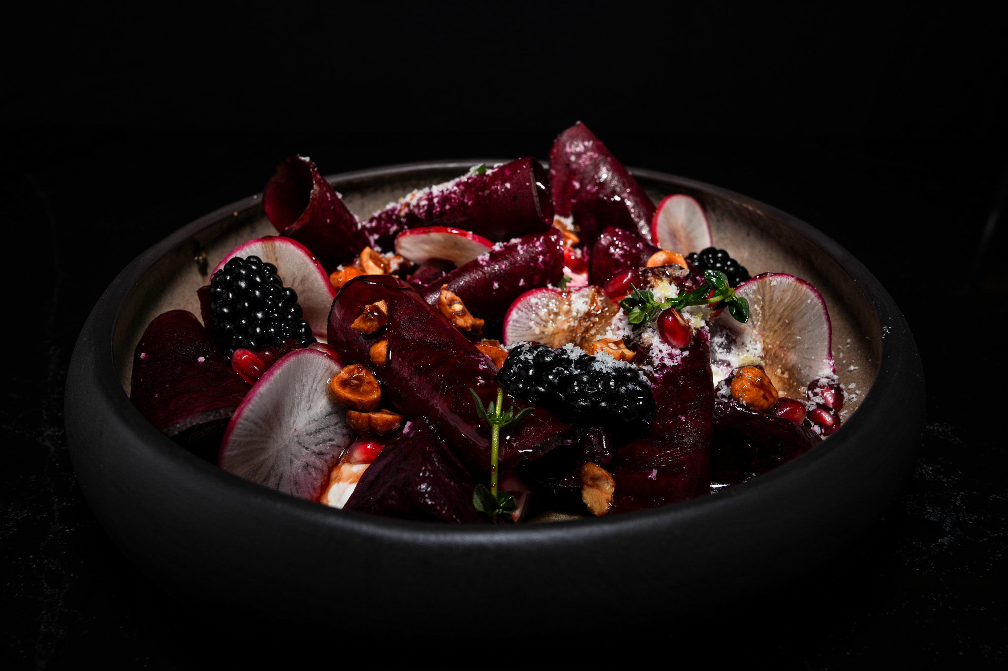 Beetroot salad with berries, radish, and nuts