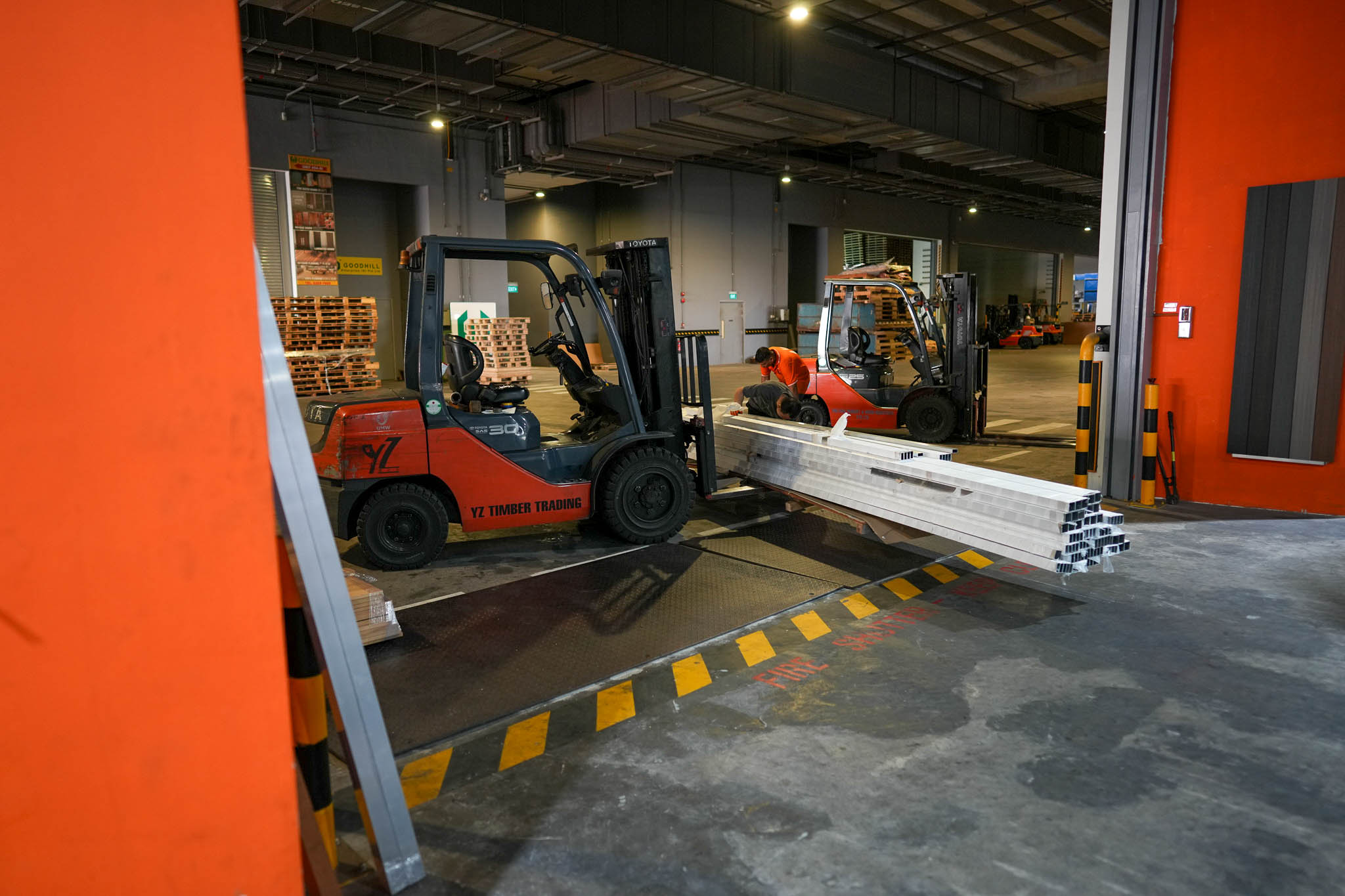 Forklift moving timber at the YZ Timber loading bay